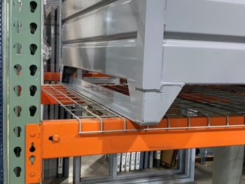 Corrugated Steel Container with Steel Angle Runners On Pallet Rack Decking