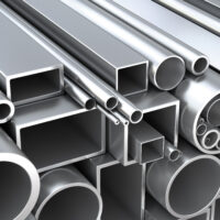 a stack of round and rectangular steel tubing