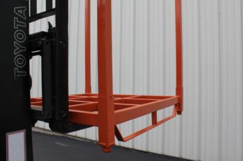 Forklift holding stack rack with steel runners